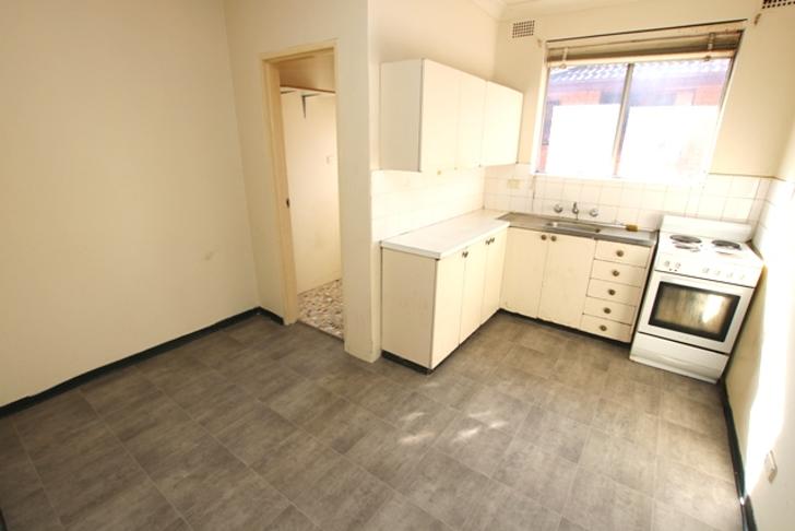 A Traditional Mudroom With A Large Closet Unit With Wood Lattic Doors To Let The Air In Mudroom Flooring Mudroom Laundry Room Mudroom Cubbies